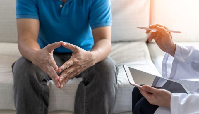 man in consultation with physician